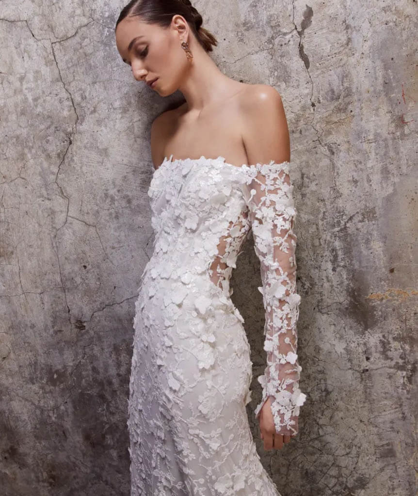 Model wearing a white dress by Rita Vinieris