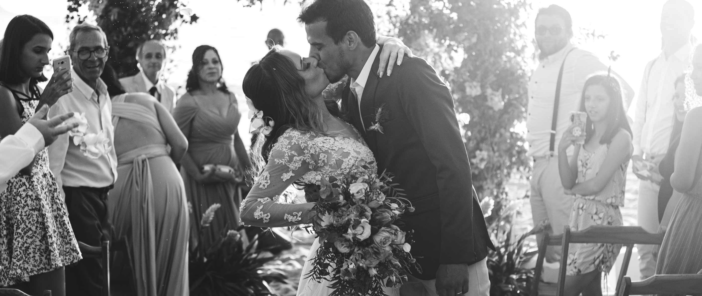 Сouple wearing a white gown and a black suit