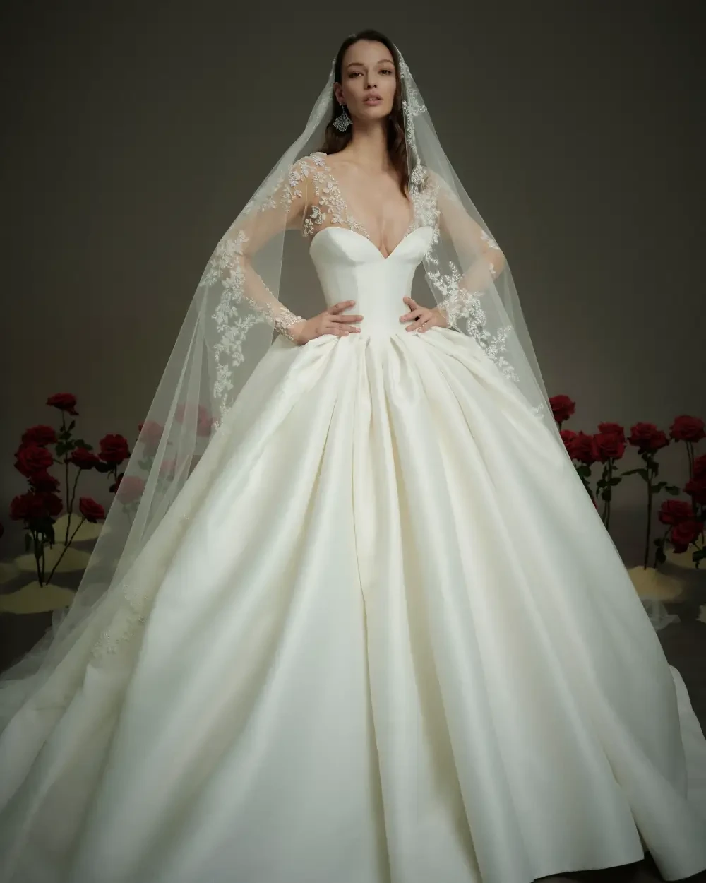 model is wearing a ball gown wedding dress