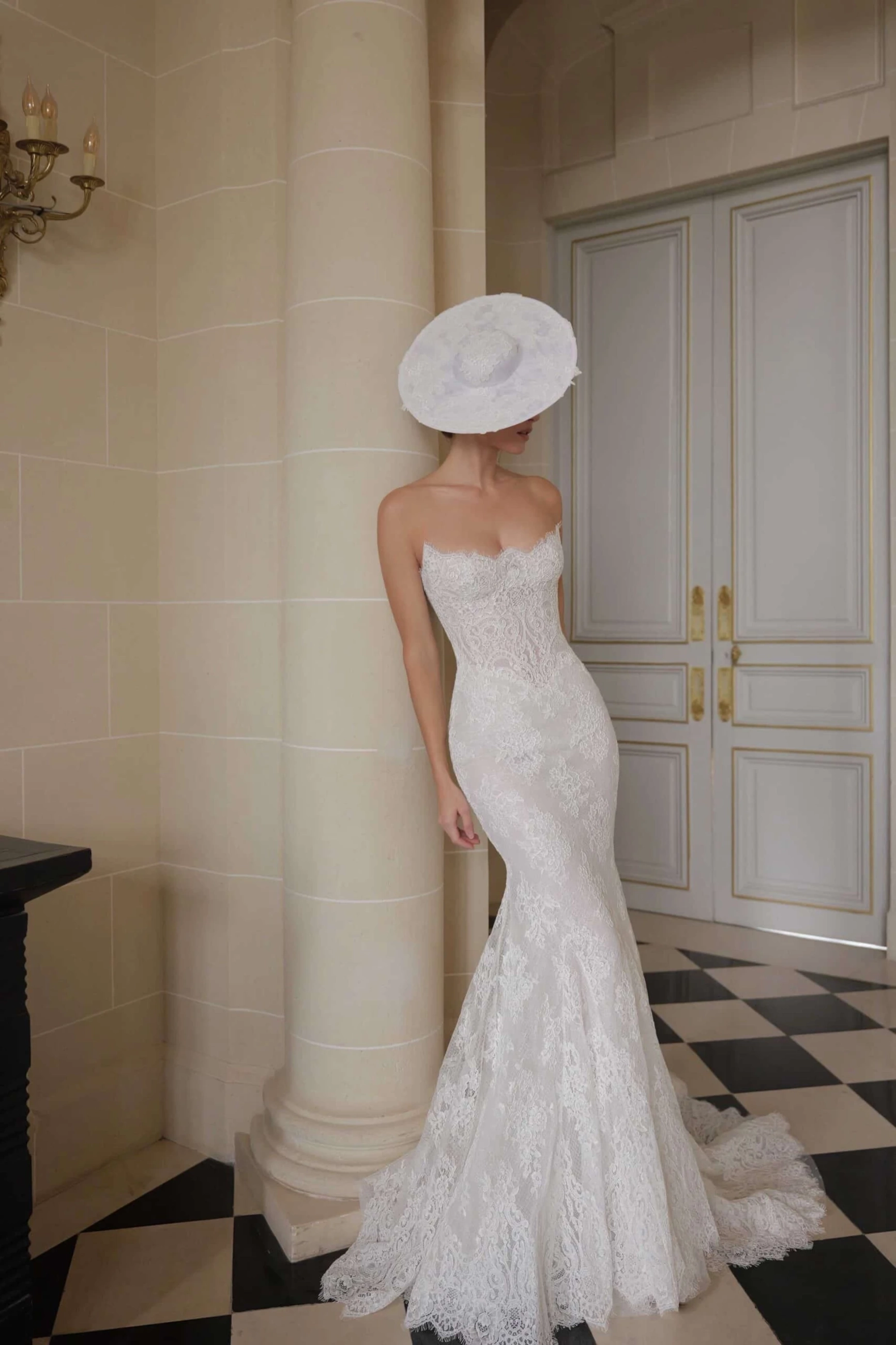 Model wearing a white dress by Lee Petra Grebenau