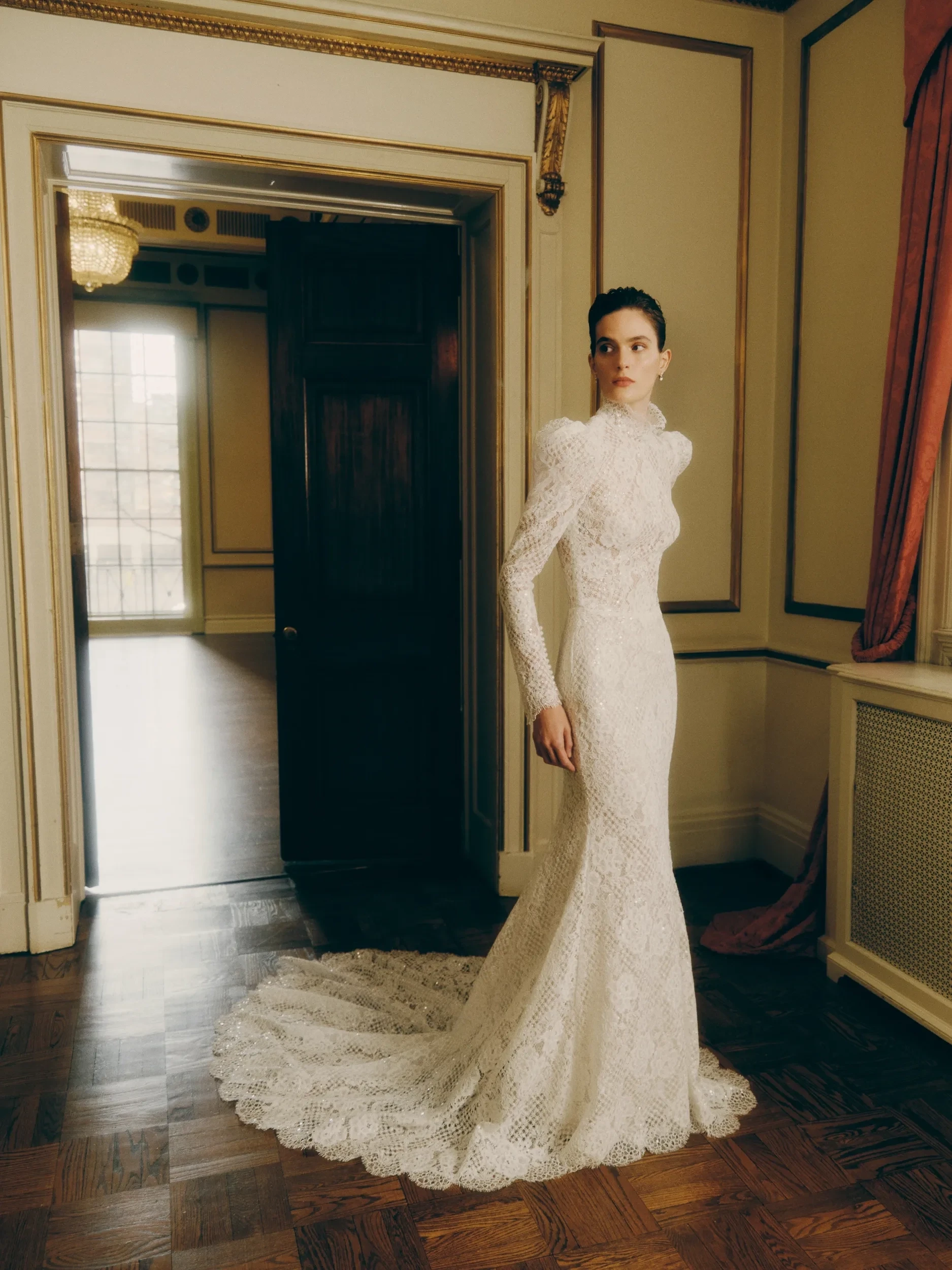 Model wearing a white dress by Rita Vinieris