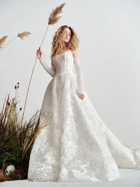Model wearing a white dress by Valdrin Sahiti